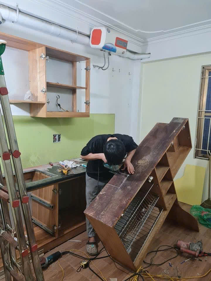 sửa tủ gỗ bị phồng do nước